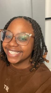 Kaila Anderson in glasses, smiling